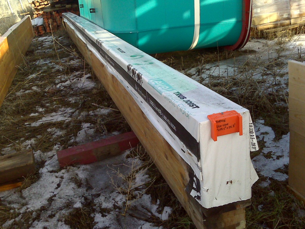Item #0046. GluLam Beam. 7"x19.5"x25'8". $175.