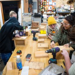 Students learning to how to build birdhouses in a Home ReSource workshop
