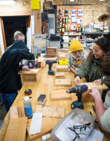Students learning to how to build birdhouses in a Home ReSource workshop